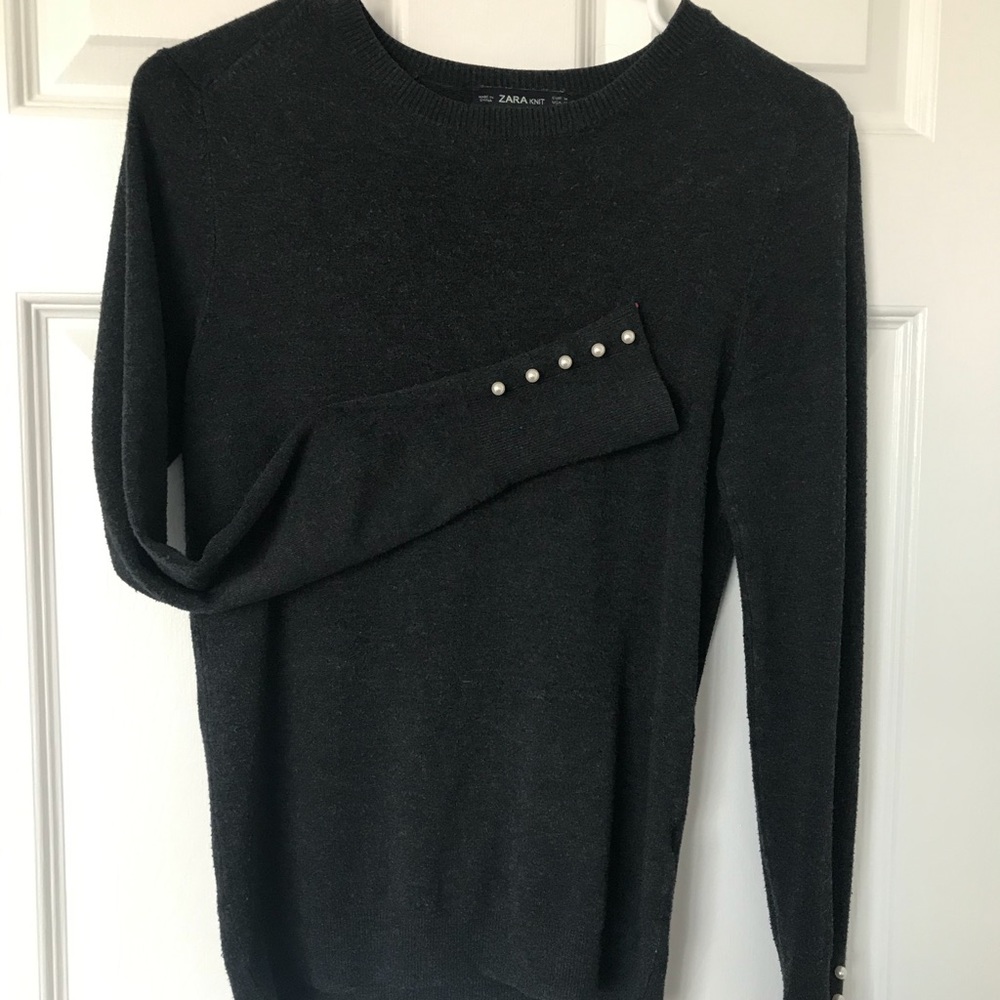 Charcoal sweater with pearl cuffs